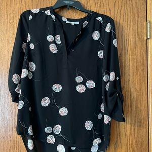 This tunic blouse is an excellent condition, has never been worn